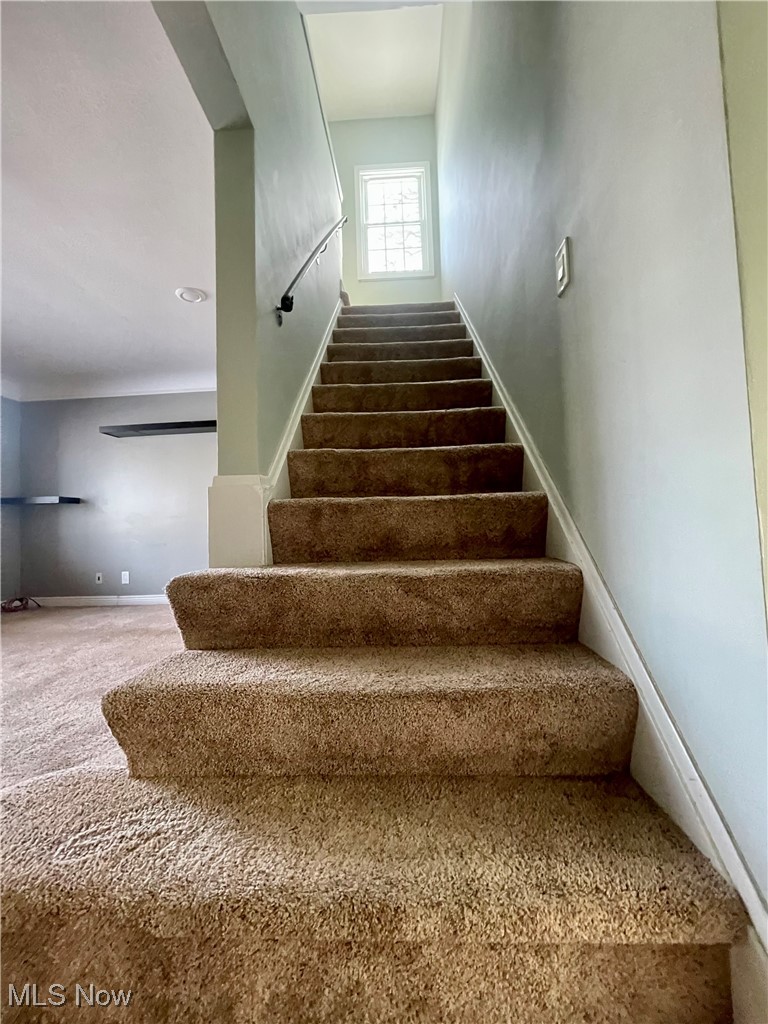 1544 Edgefield Road Lyndhurst, OH 44124 - Photo 20 of 36 Staircase featuring baseboards and carpet floors