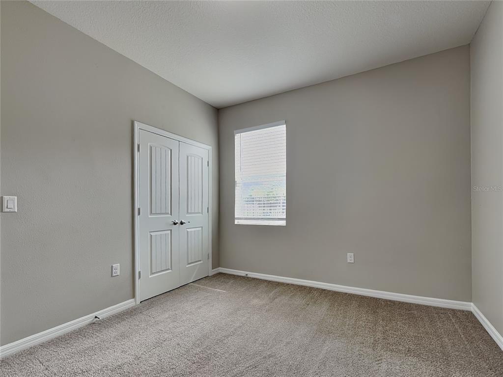 Undisclosed Address Spring Hill, FL 34609 - Photo 12 of 17 an empty room with windows