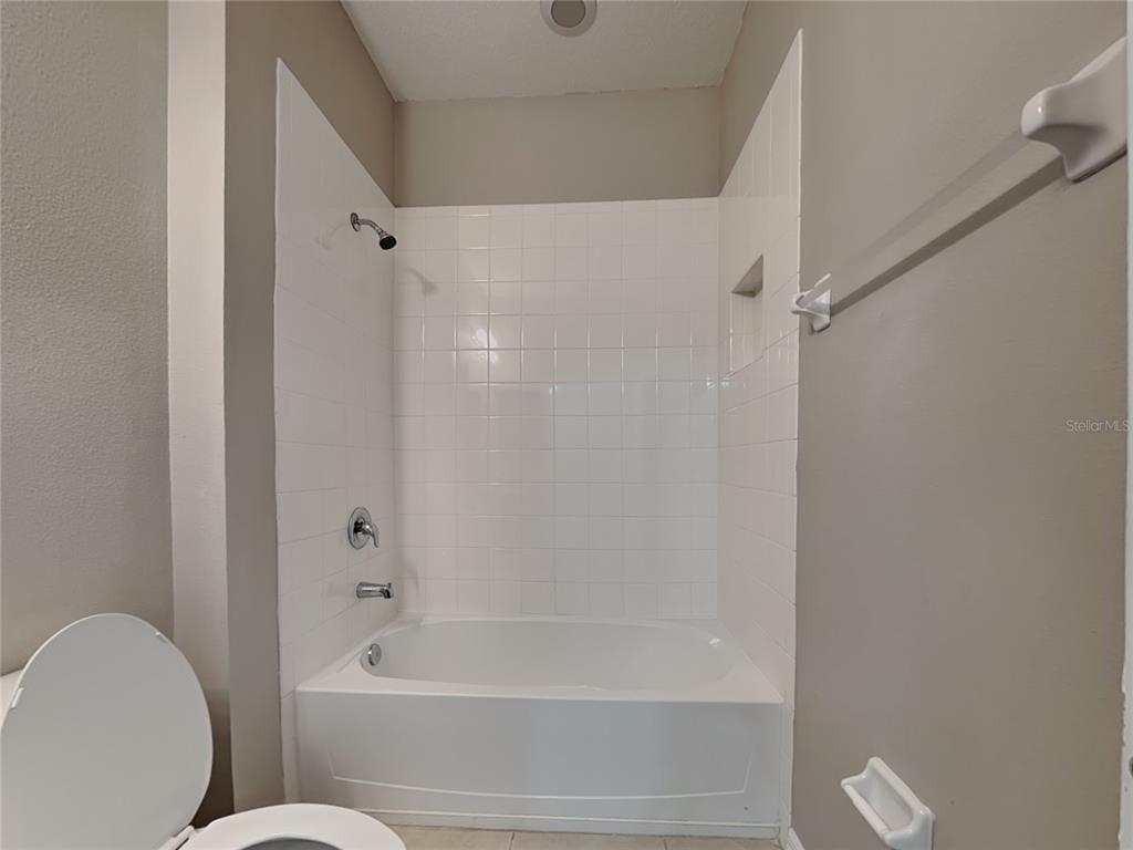 Undisclosed Address Spring Hill, FL 34609 - Photo 16 of 17 a bathroom with a shower and a toilet