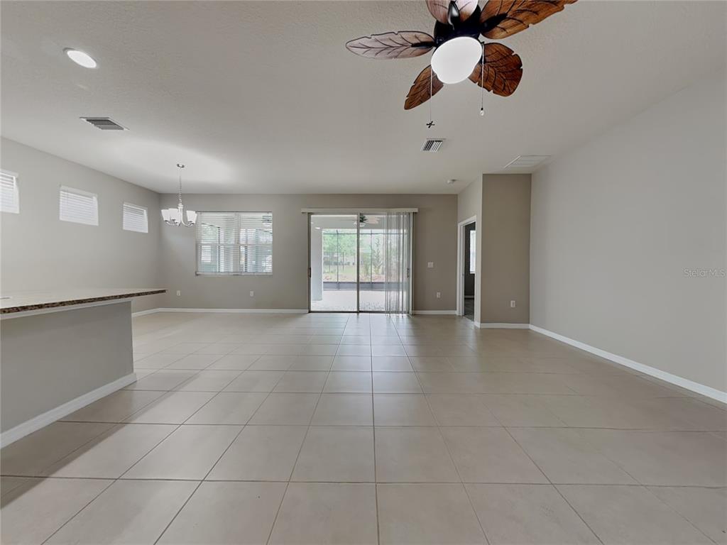 Undisclosed Address Spring Hill, FL 34609 - Photo 3 of 17 a view of an empty room with a window