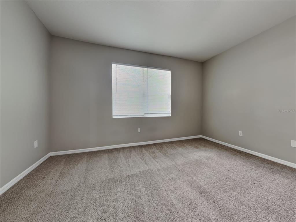 Undisclosed Address Spring Hill, FL 34609 - Photo 7 of 17 an empty room with a window
