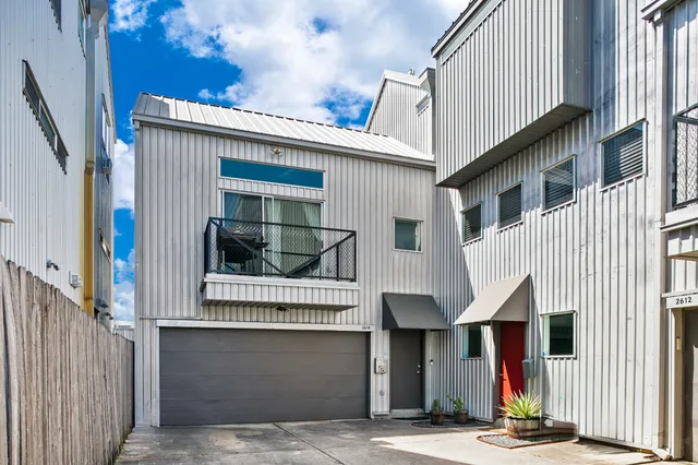 a front view of a house with garage