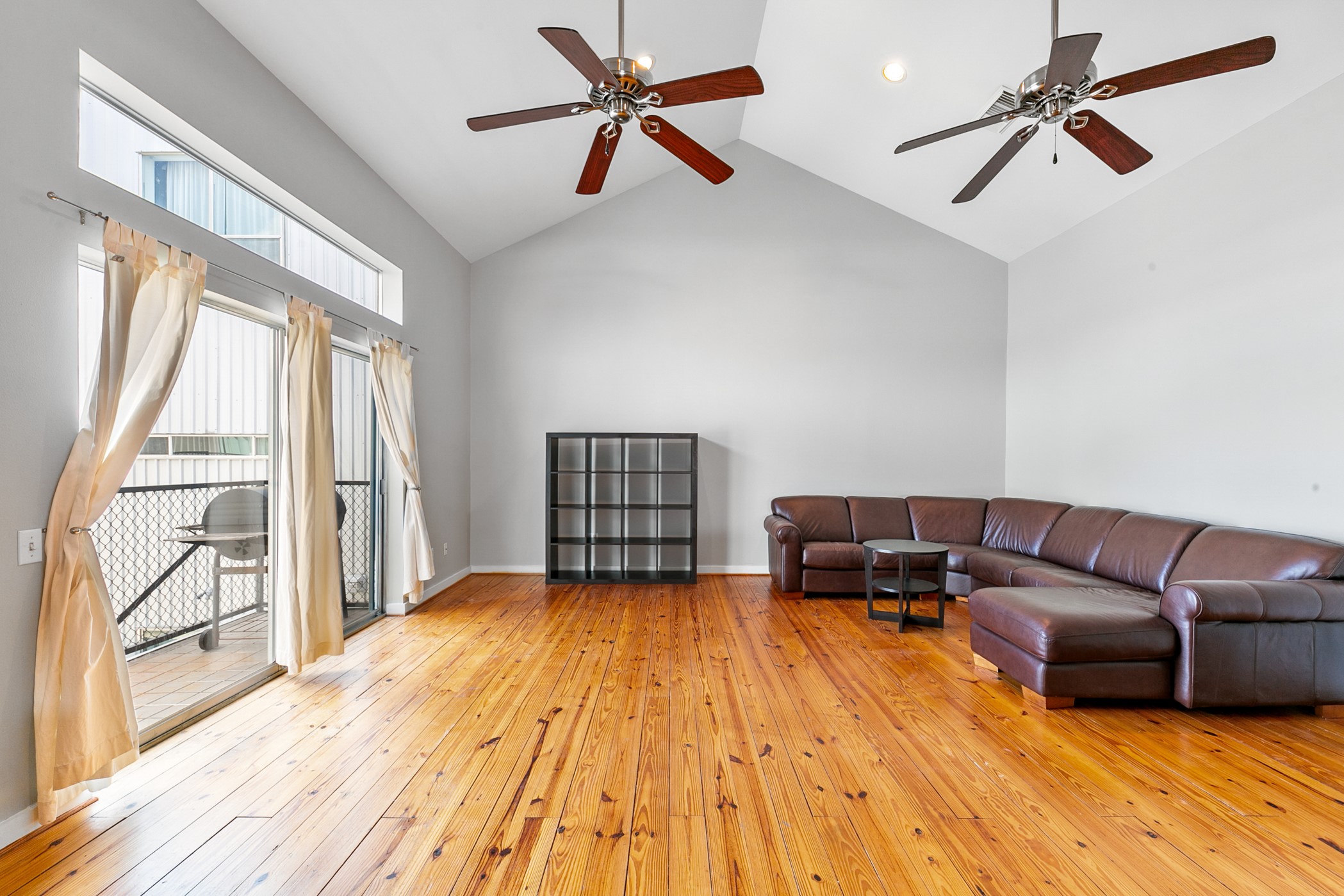 2614 Chenevert Street Houston, TX 77004 - Photo 17 of 34 a living room with furniture and a large window