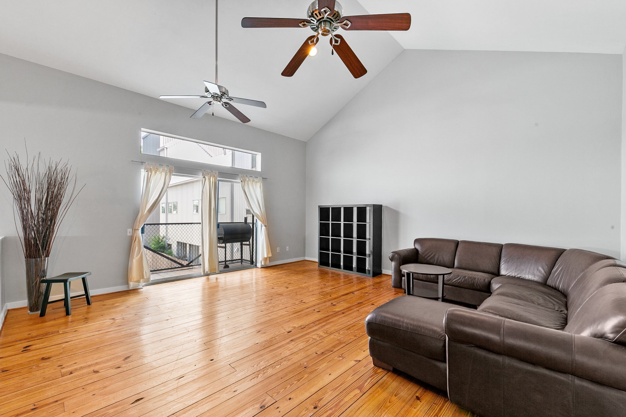 2614 Chenevert Street Houston, TX 77004 - Photo 18 of 34 a living room with furniture and a wooden floor