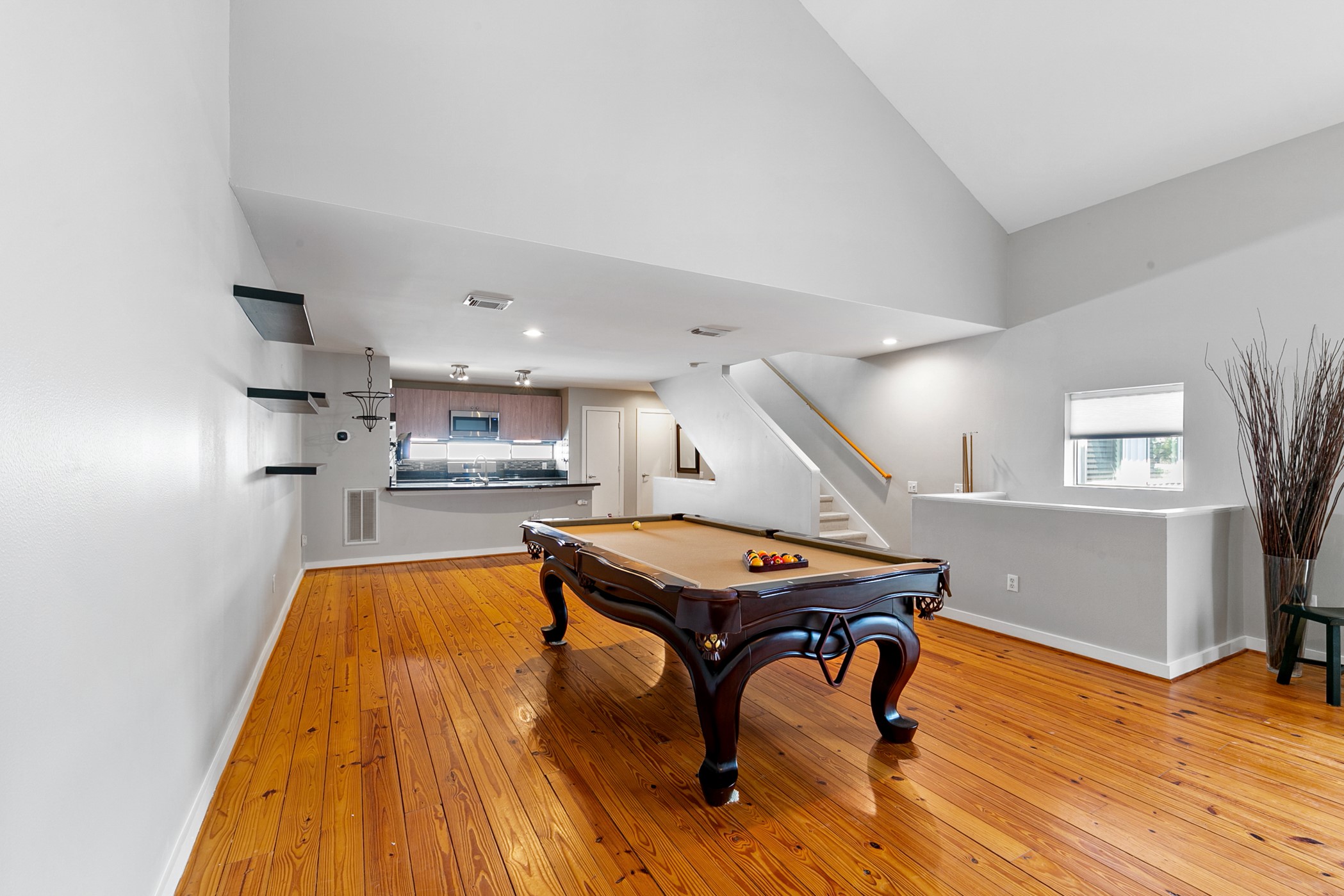 2614 Chenevert Street Houston, TX 77004 - Photo 19 of 34 a room with furniture and a wooden floor