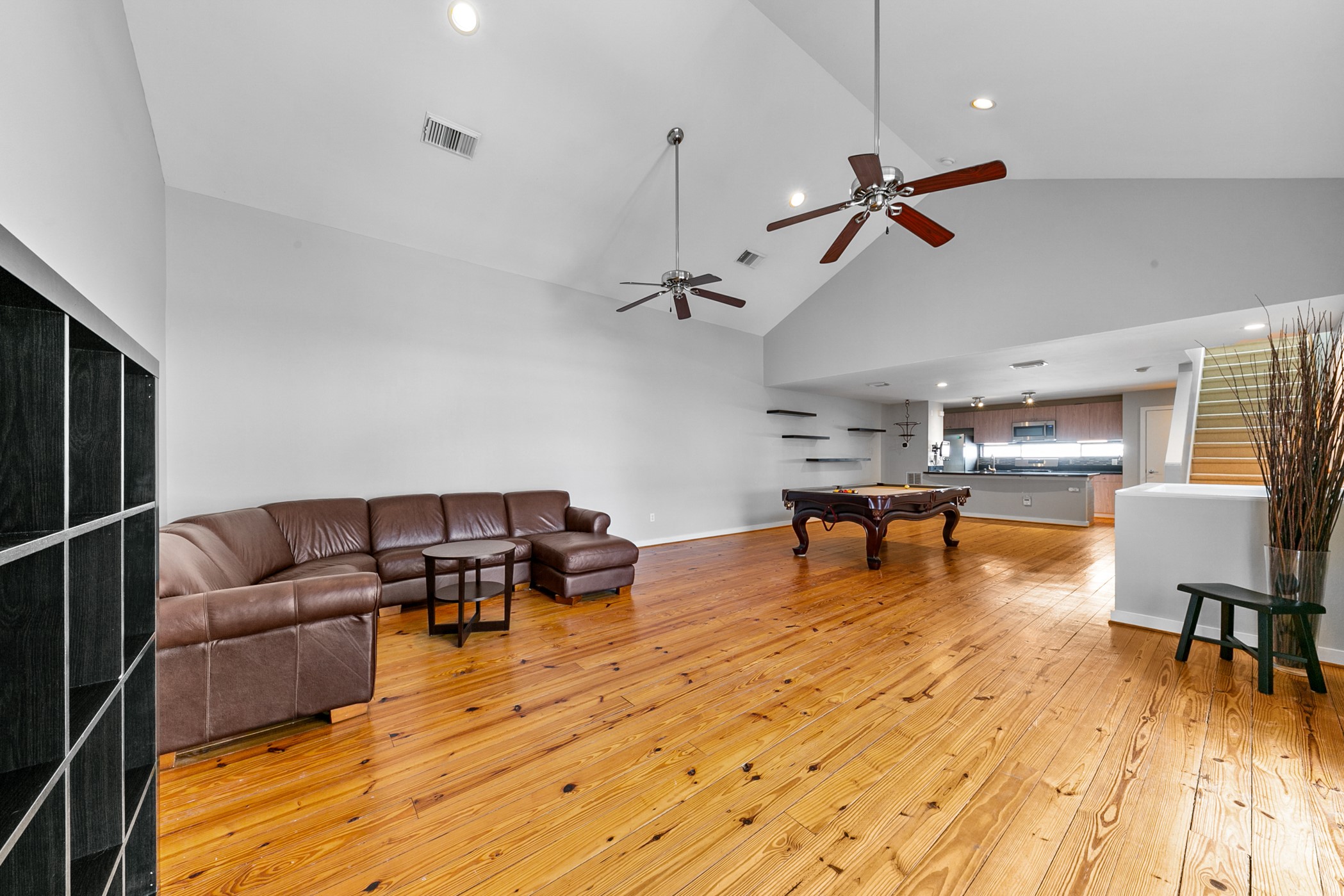 2614 Chenevert Street Houston, TX 77004 - Photo 21 of 34 a living room with furniture and a wooden floor