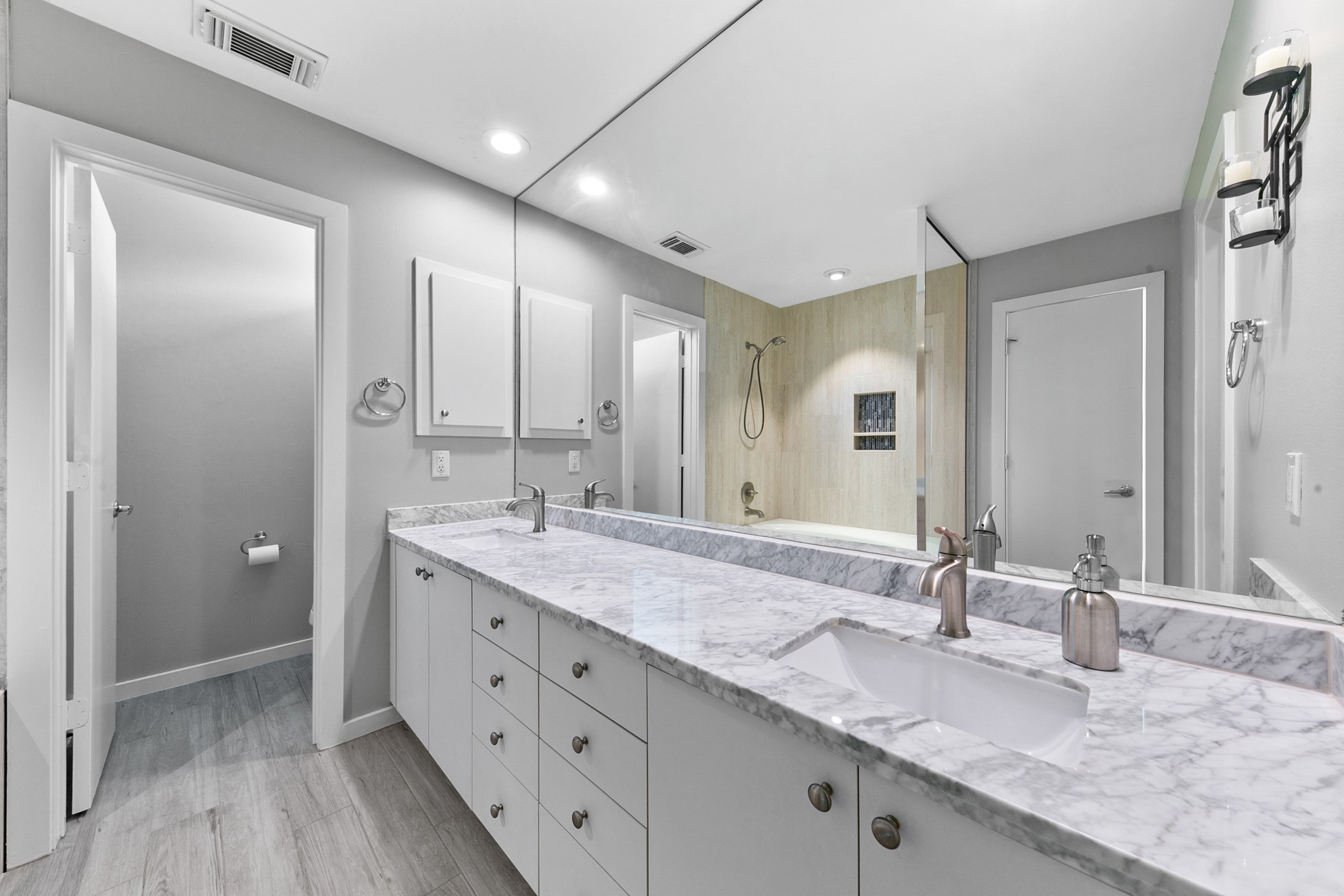 2614 Chenevert Street Houston, TX 77004 - Photo 27 of 34 a bathroom with double sink and a mirror