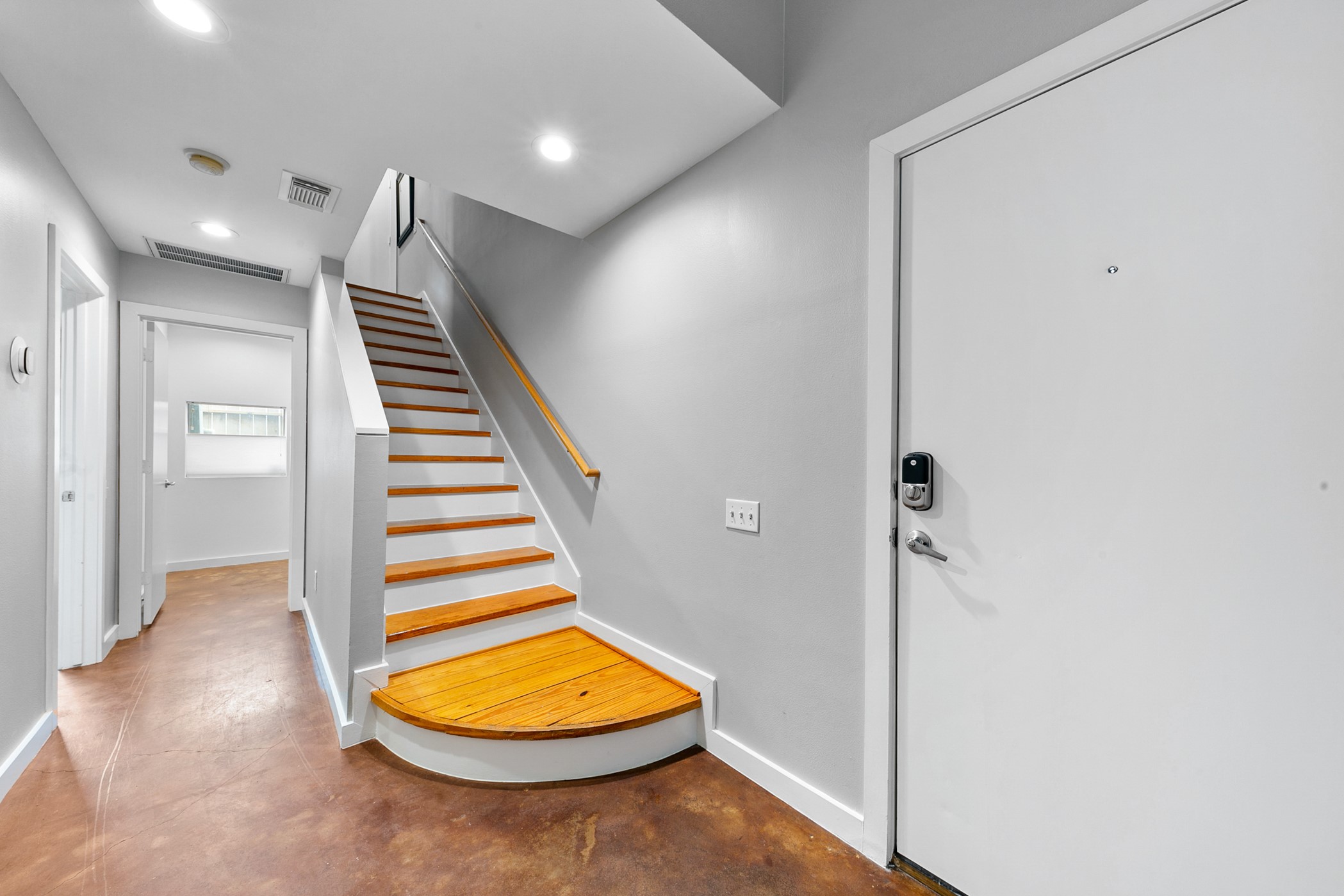2614 Chenevert Street Houston, TX 77004 - Photo 4 of 34 an empty room with wooden floor and white walls