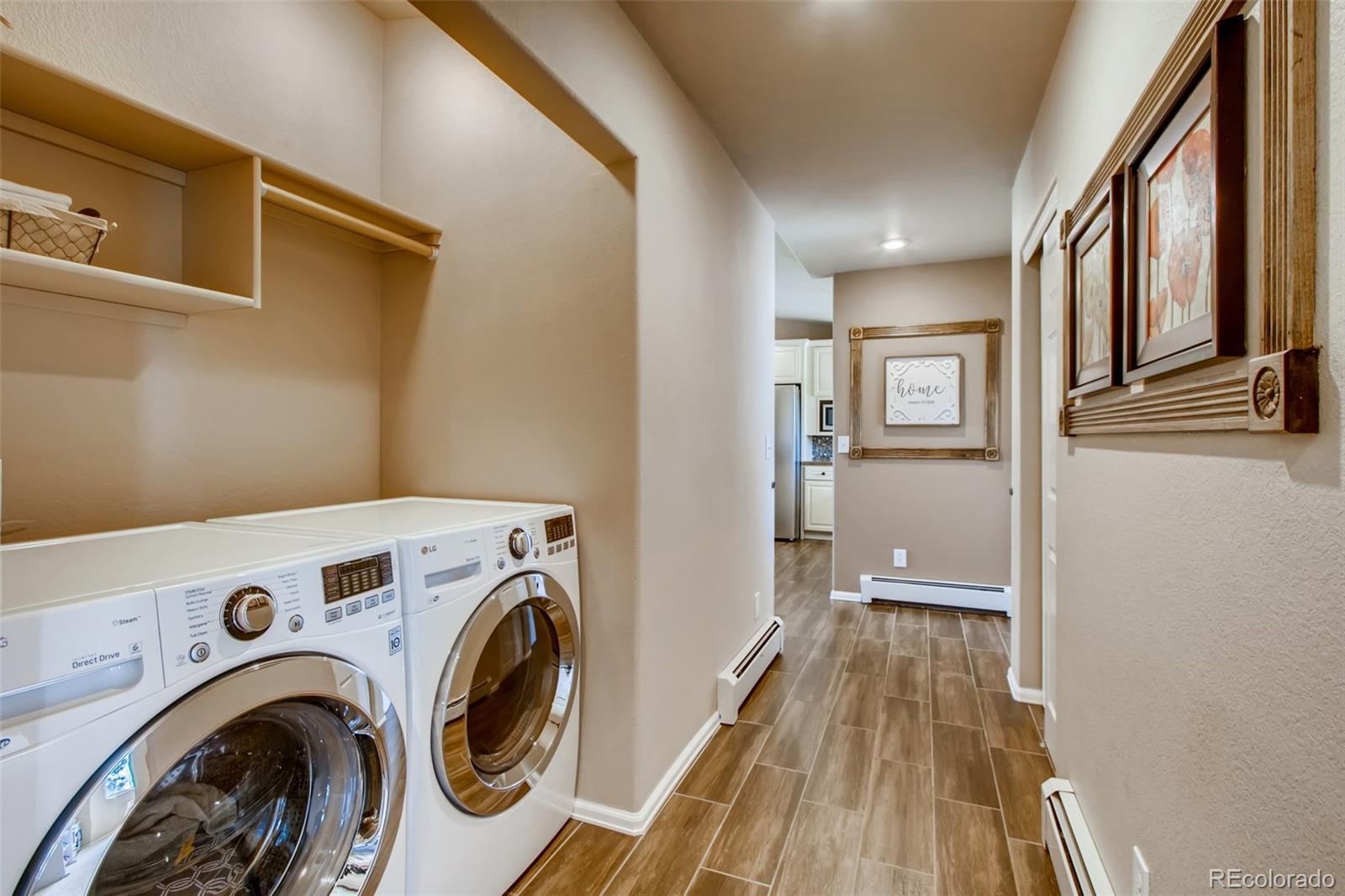 18030 Ranch Hand Road Peyton, CO 80831 - Photo 17 of 40 a view of a storage & utility room with washer and dryer