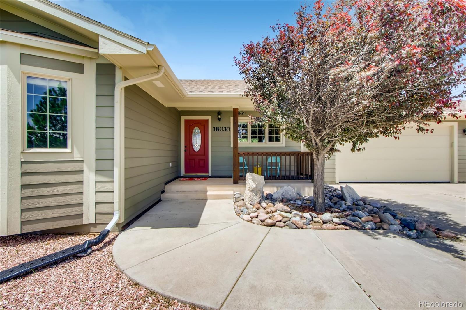 18030 Ranch Hand Road Peyton, CO 80831 - Photo 3 of 40 a front view of a house