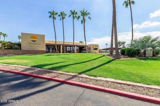 a view of a swimming pool with outdoor seating