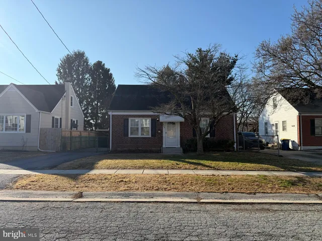 a view of a house with snow on the road