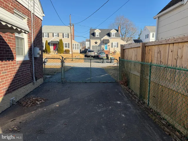 a view of a patio with table and chairs