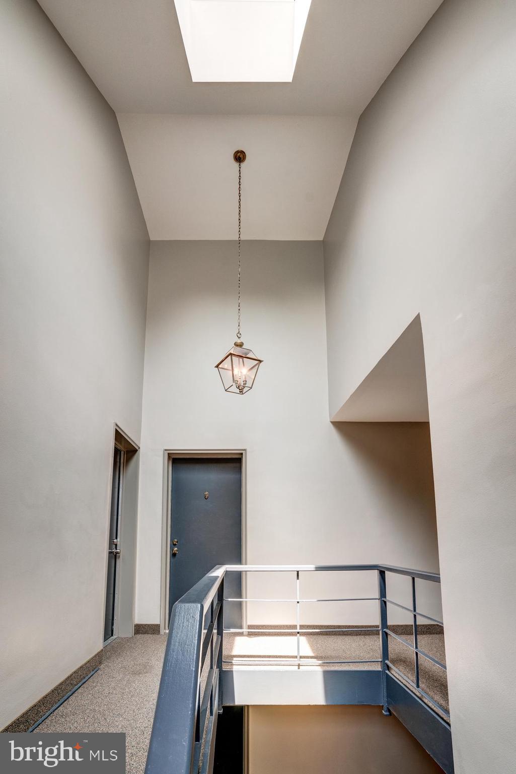 8205 Grubb Road, Unit G202 Silver Spring, MD 20910 - Photo 2 of 38 WELL CARED COMMON AREA W/SKYLIT CATHEDRAL CEILING