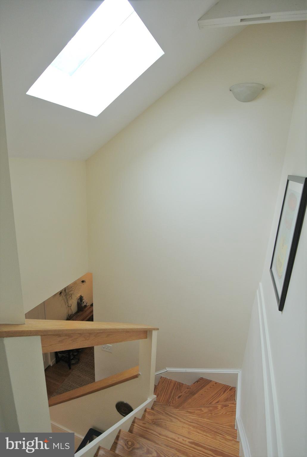 8205 Grubb Road, Unit G202 Silver Spring, MD 20910 - Photo 17 of 38 EVEN THE STAIRCASE IS SKYLIT.