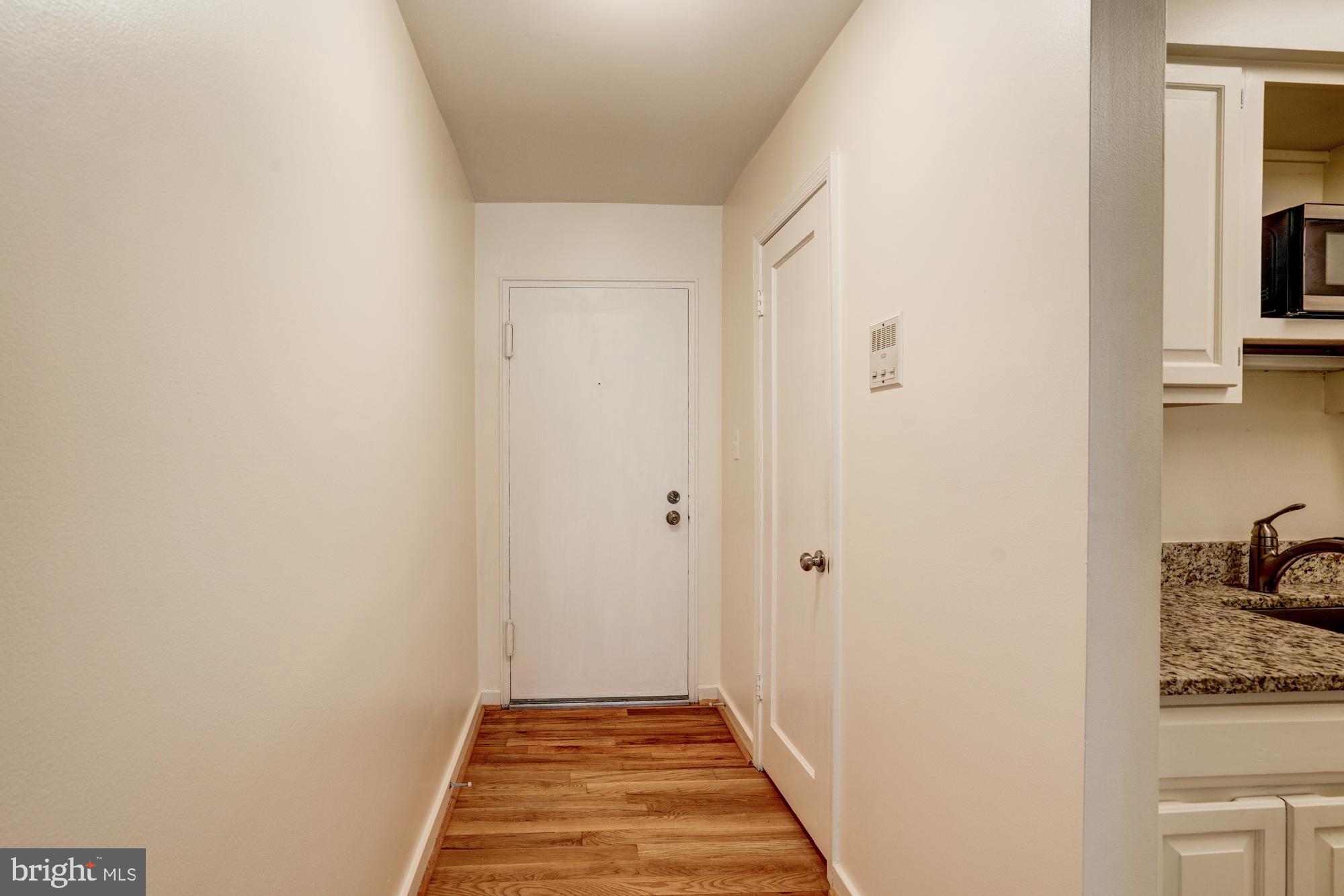 8205 Grubb Road, Unit G202 Silver Spring, MD 20910 - Photo 4 of 38 FRONT DOOR. ENTRY FOYER FROM OTHER DIRECTION..