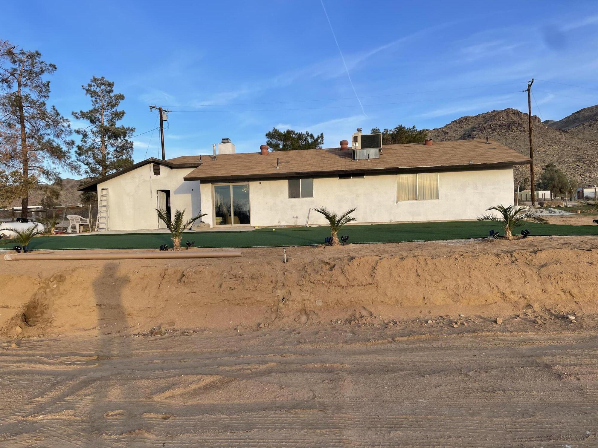 14818 Desert Star Road Apple Valley, CA 92307 - Photo 6 of 10 front view of a house with a yard