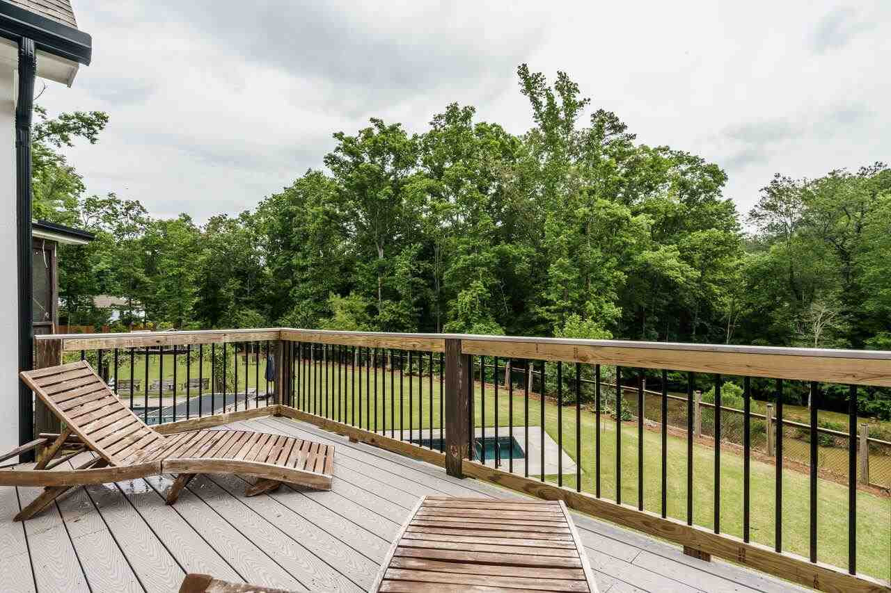 4709 Bountiful Lane Apex, NC 27539 - Photo 13 of 30 a view of balcony with wooden floor and fence