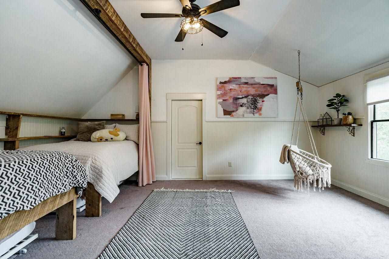 4709 Bountiful Lane Apex, NC 27539 - Photo 17 of 30 a bedroom with a bed and furniture