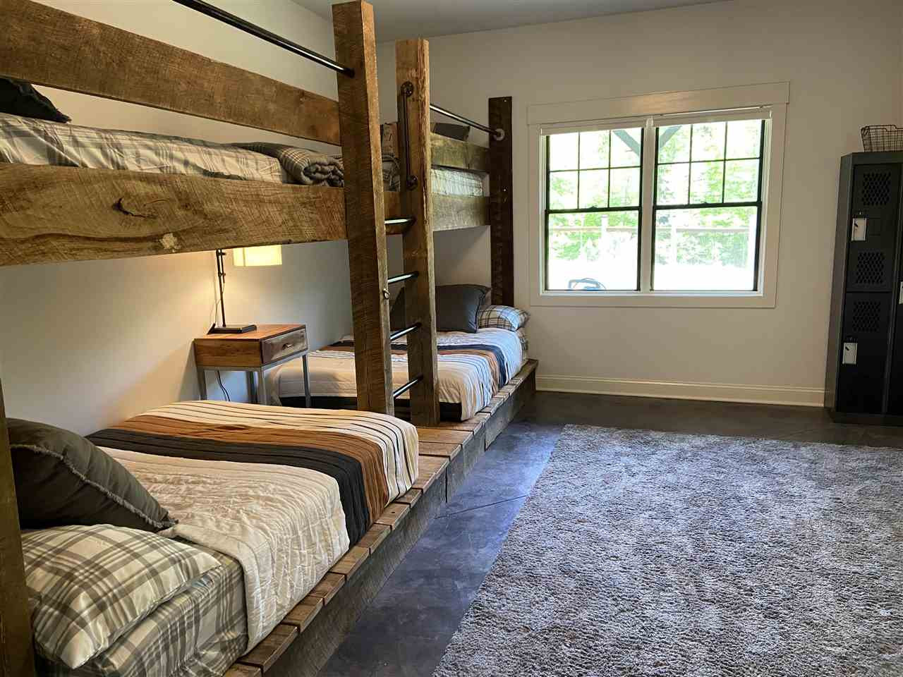 4709 Bountiful Lane Apex, NC 27539 - Photo 18 of 30 a bedroom with two beds and a window