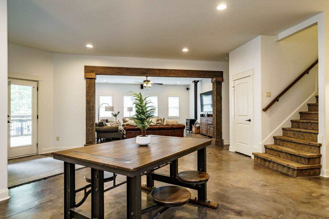 4709 Bountiful Lane Apex, NC 27539 - Photo 19 of 30 a view of a dining room with furniture and wooden floor