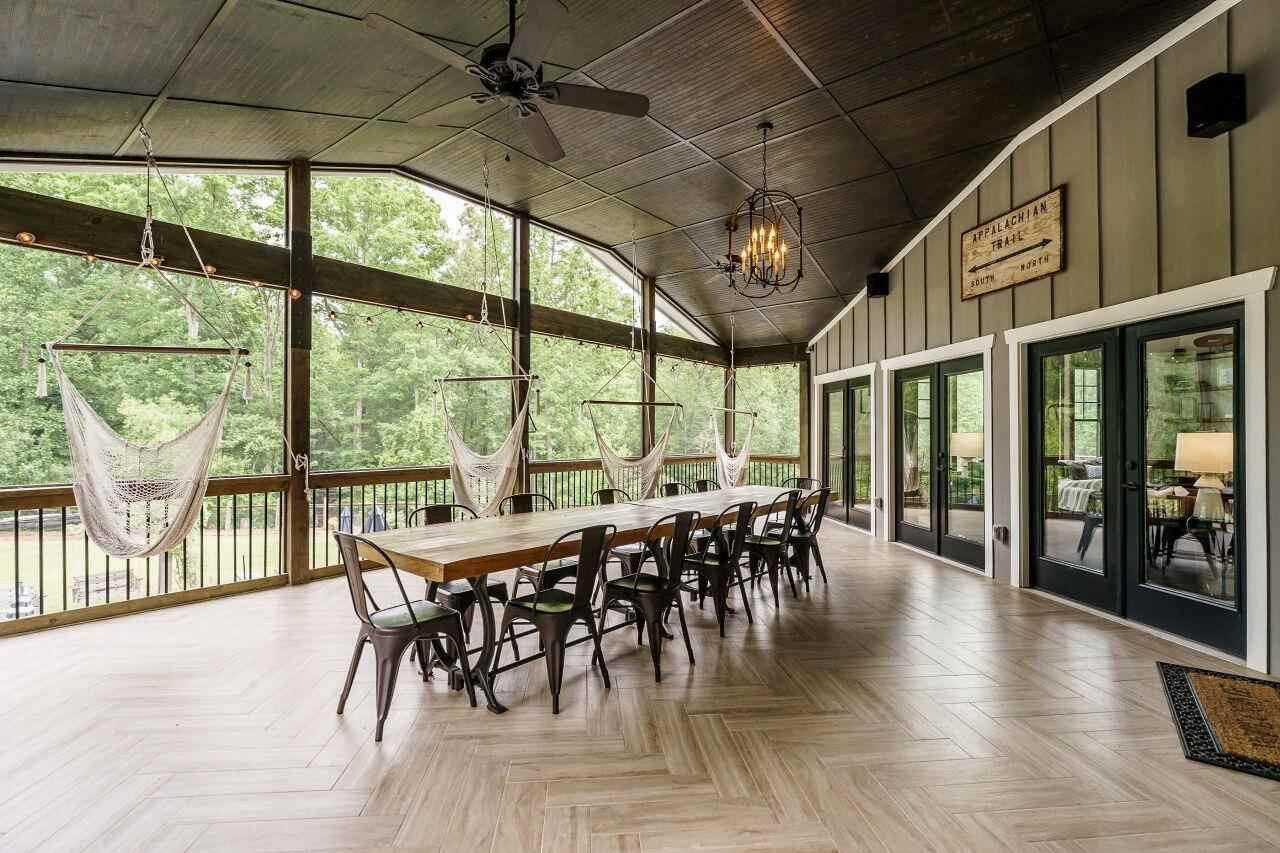 4709 Bountiful Lane Apex, NC 27539 - Photo 26 of 30 a view of a dining room with furniture window and wooden floor