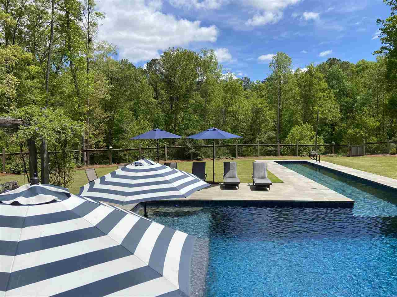 4709 Bountiful Lane Apex, NC 27539 - Photo 27 of 30 a view of a patio with swimming pool