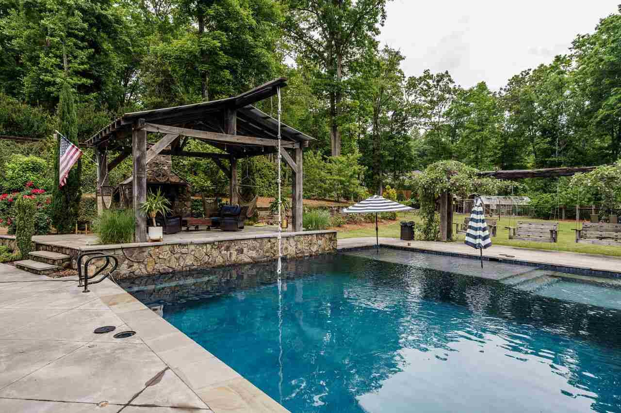 4709 Bountiful Lane Apex, NC 27539 - Photo 28 of 30 a view of house with swimming pool and outdoor seating
