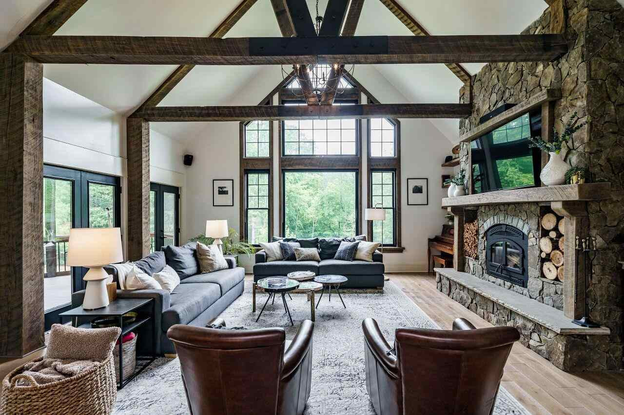 4709 Bountiful Lane Apex, NC 27539 - Photo 3 of 30 a living room with furniture a large window and a fireplace