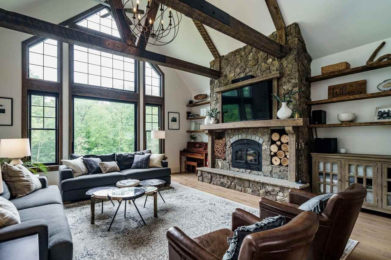 4709 Bountiful Lane Apex, NC 27539 - Photo 4 of 30 a living room with furniture a flat screen tv and a fireplace