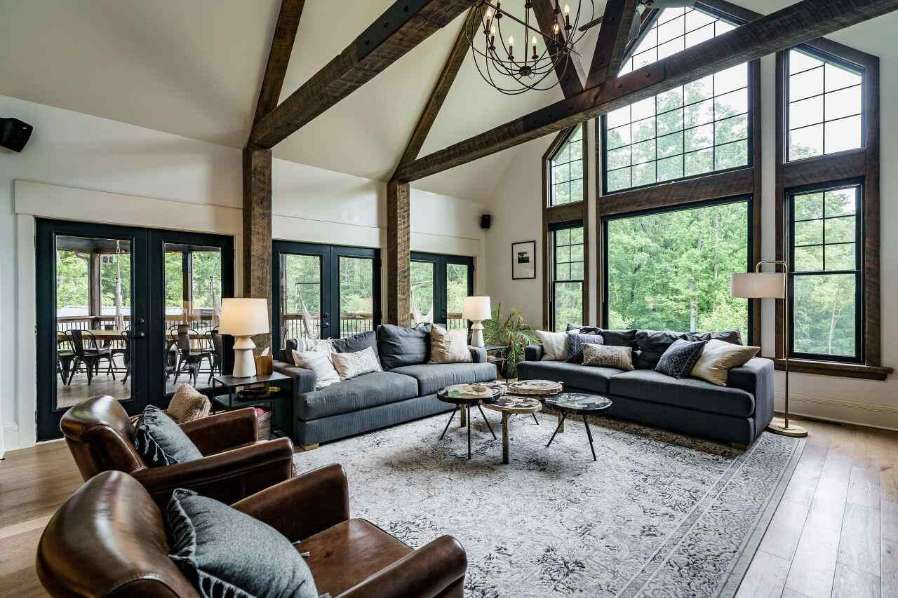 4709 Bountiful Lane Apex, NC 27539 - Photo 5 of 30 a living room with furniture and floor to ceiling windows