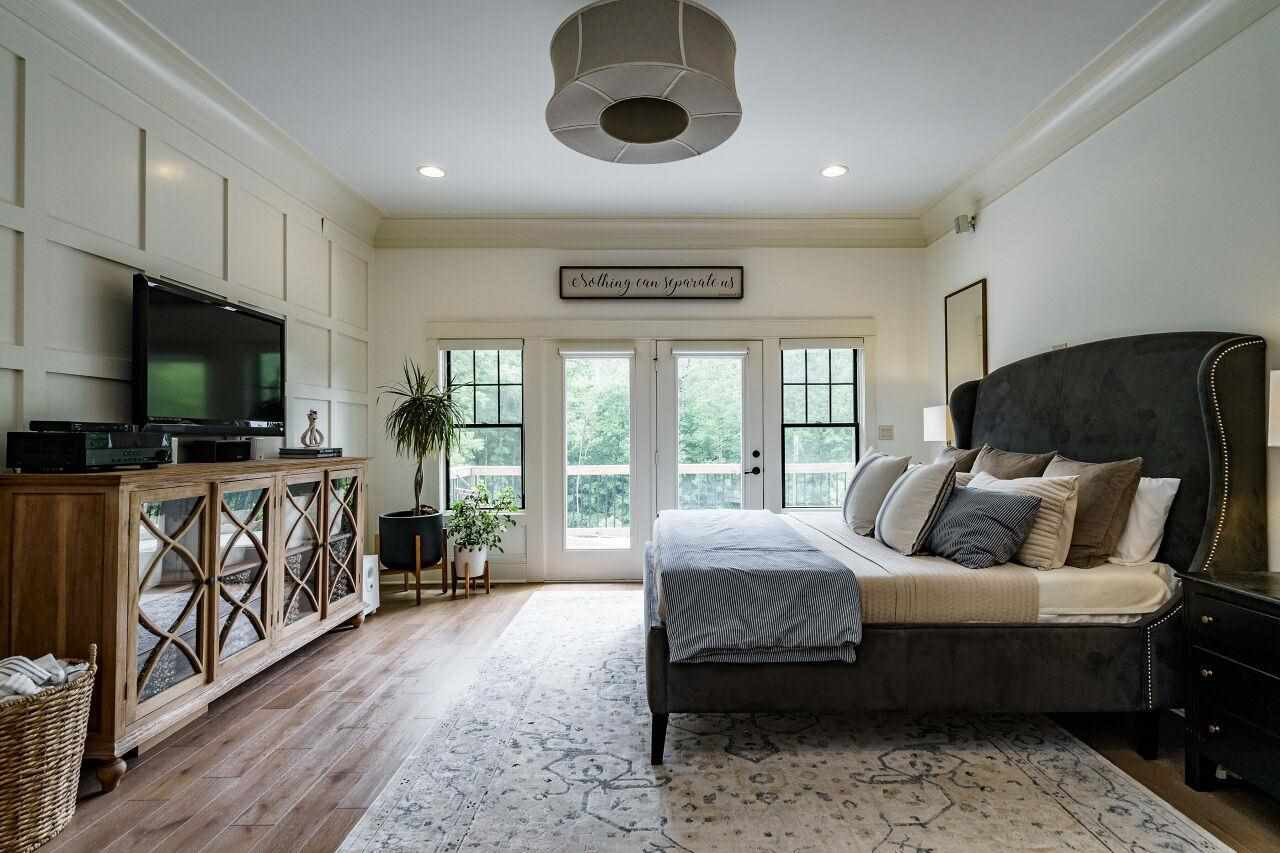 4709 Bountiful Lane Apex, NC 27539 - Photo 10 of 30 a living room with furniture and a flat screen tv