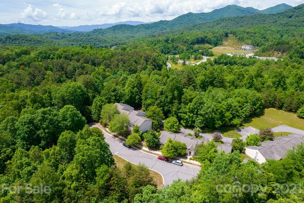 171 North Ridge Point, Unit V3 Sylva, NC 28779 - Photo 17 of 29 a view of a lush green hillside and houses