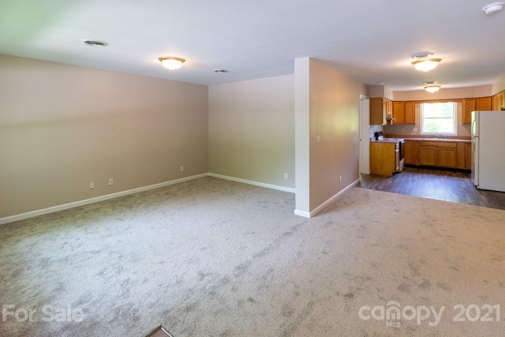 171 North Ridge Point, Unit V3 Sylva, NC 28779 - Photo 4 of 29 a view of a big room with closet and windows