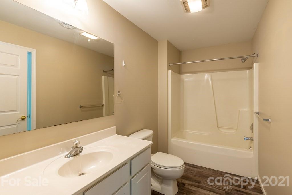 171 North Ridge Point, Unit V3 Sylva, NC 28779 - Photo 9 of 29 a bathroom with a sink toilet and shower