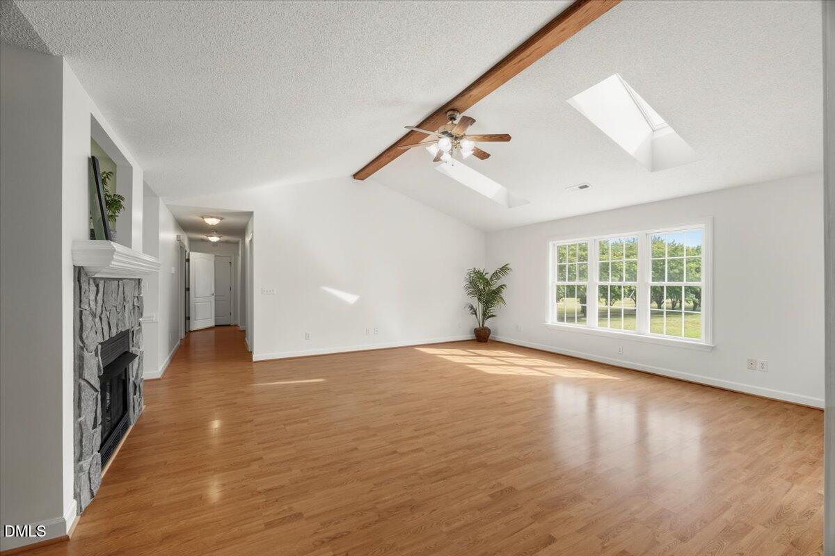 685 River Run Road Selma, NC 27576 - Photo 11 of 27 a view of an empty room with wooden floor and a window
