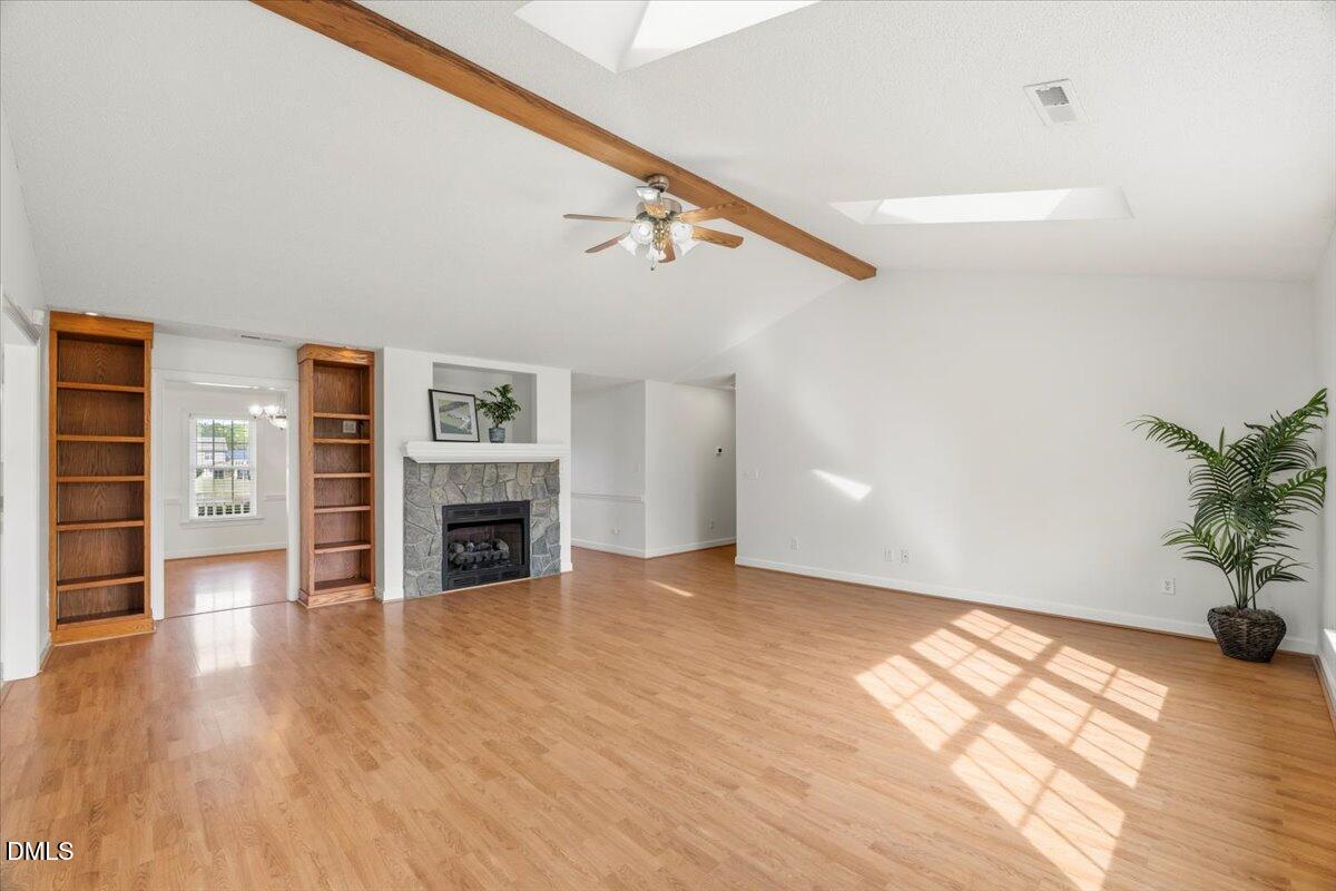 685 River Run Road Selma, NC 27576 - Photo 12 of 27 a view of a livingroom with a fireplace wooden floor and window