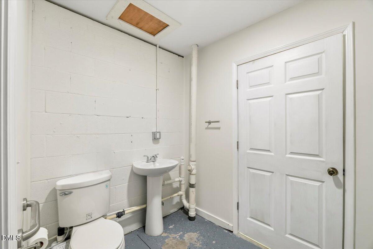 685 River Run Road Selma, NC 27576 - Photo 23 of 27 a white toilet sitting next to a bathroom sink