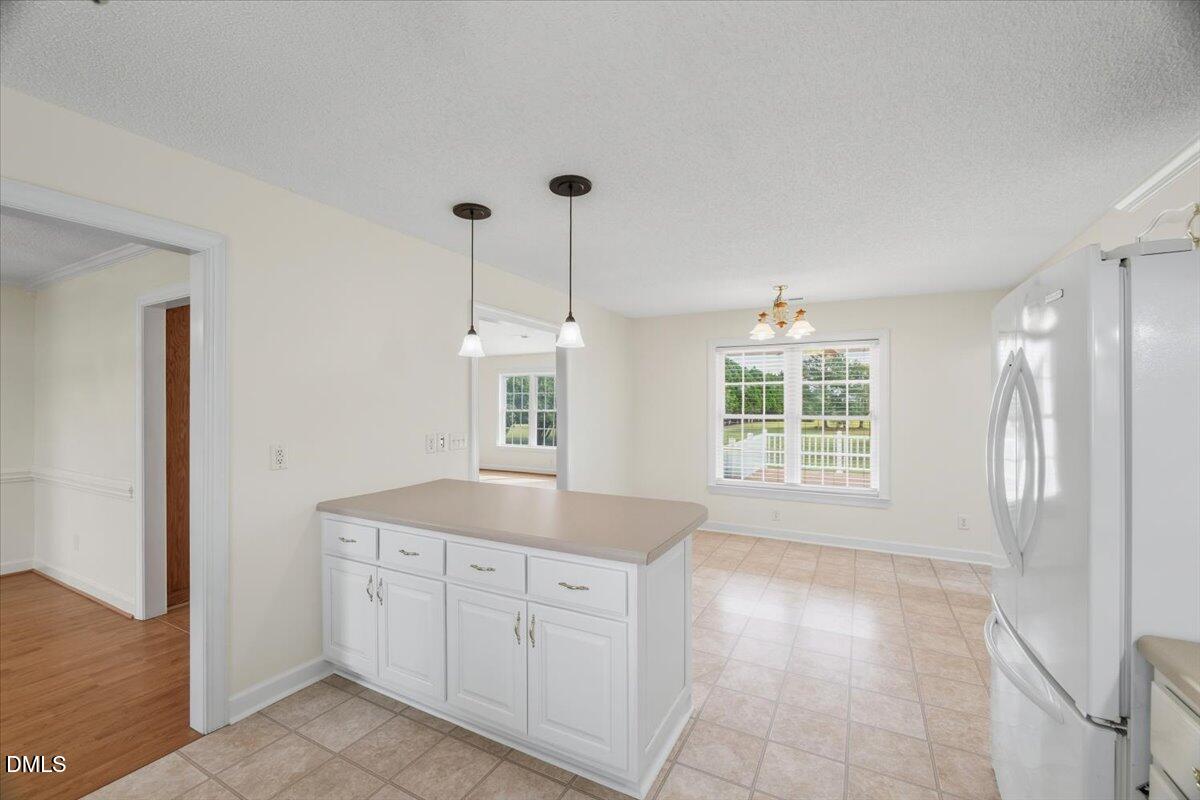 685 River Run Road Selma, NC 27576 - Photo 8 of 27 a spacious bathroom with a granite countertop sink a mirror and a shower