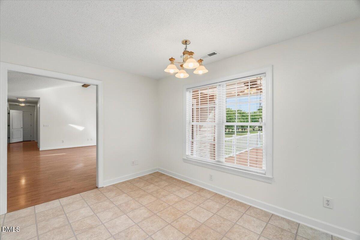 685 River Run Road Selma, NC 27576 - Photo 10 of 27 a view of an empty room with a window