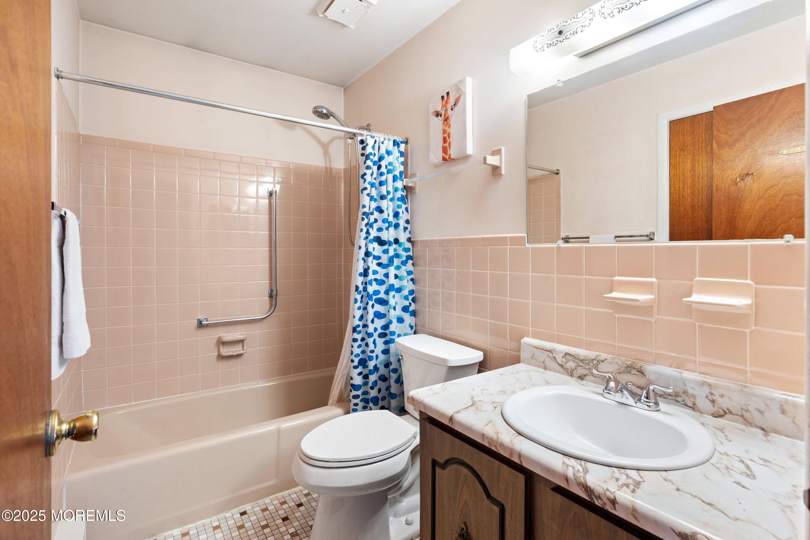 10 Magnolia Road, Unit 19 Manahawkin, NJ 08050 - Photo 15 of 30 a bathroom with a sink toilet and shower