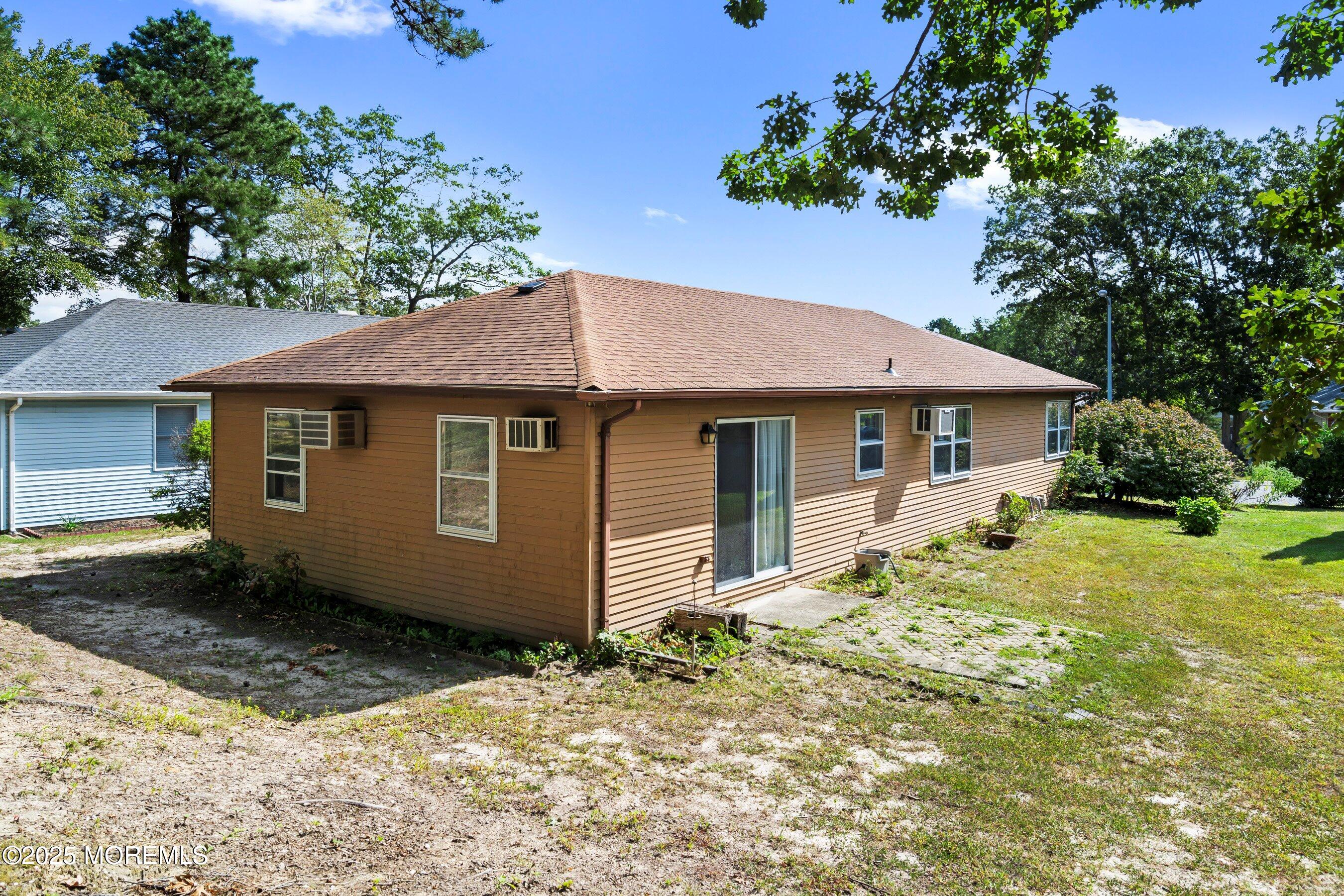 10 Magnolia Road, Unit 19 Manahawkin, NJ 08050 - Photo 20 of 30 a front view of a house with a garden