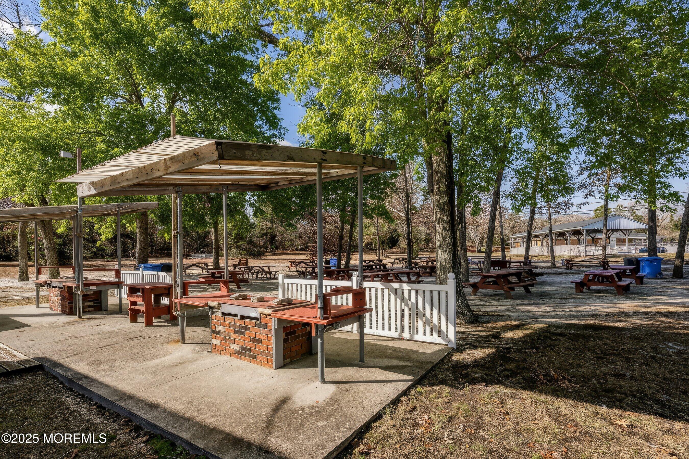 10 Magnolia Road, Unit 19 Manahawkin, NJ 08050 - Photo 29 of 30 a view of outdoor space yard and patio