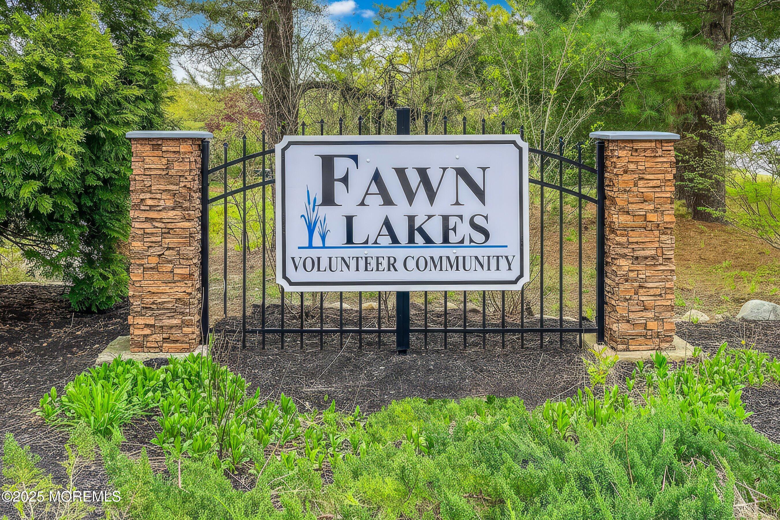 10 Magnolia Road, Unit 19 Manahawkin, NJ 08050 - Photo 3 of 30 a sign on the side of a building
