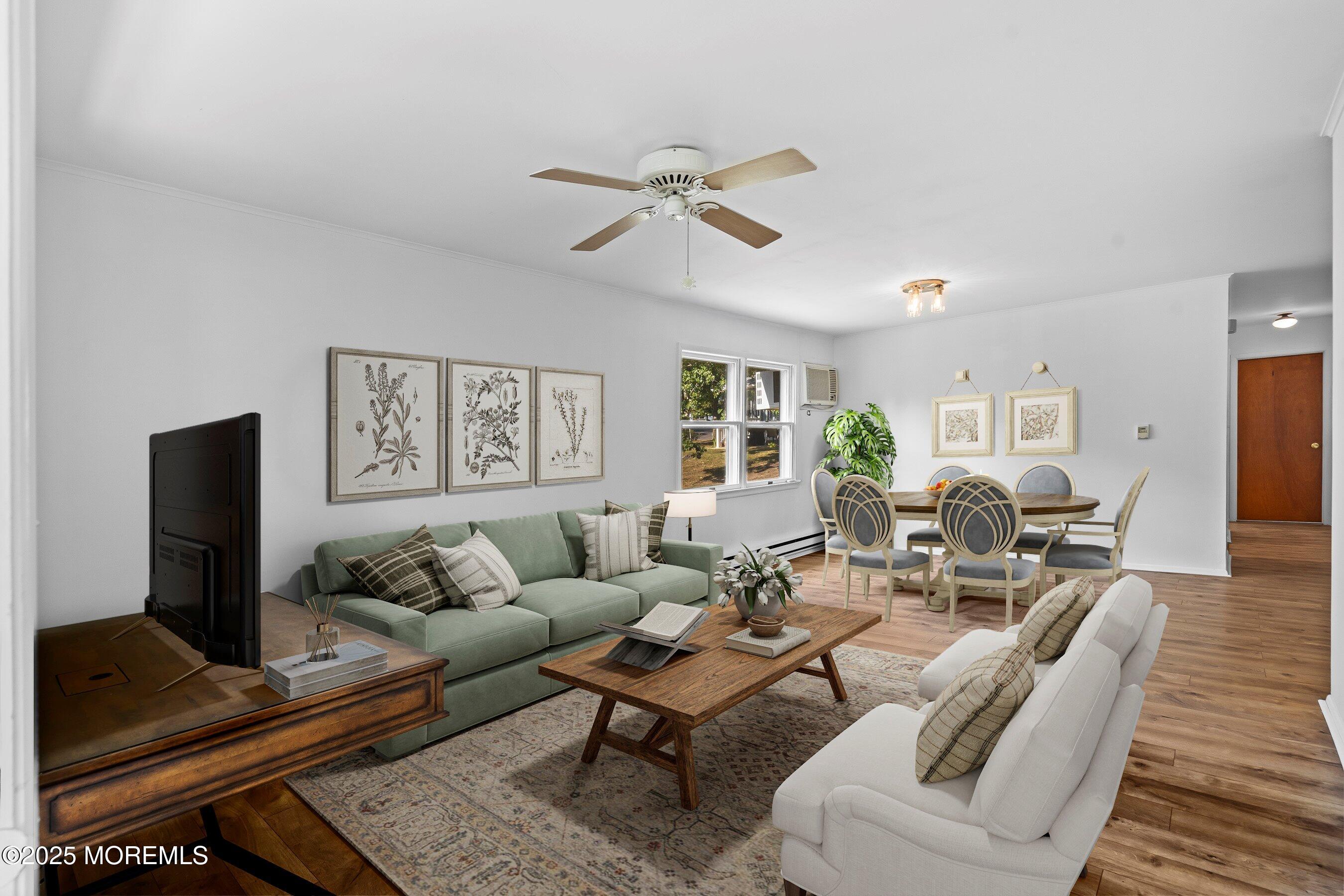 10 Magnolia Road, Unit 19 Manahawkin, NJ 08050 - Photo 8 of 30 a living room with furniture a flat screen tv and a window