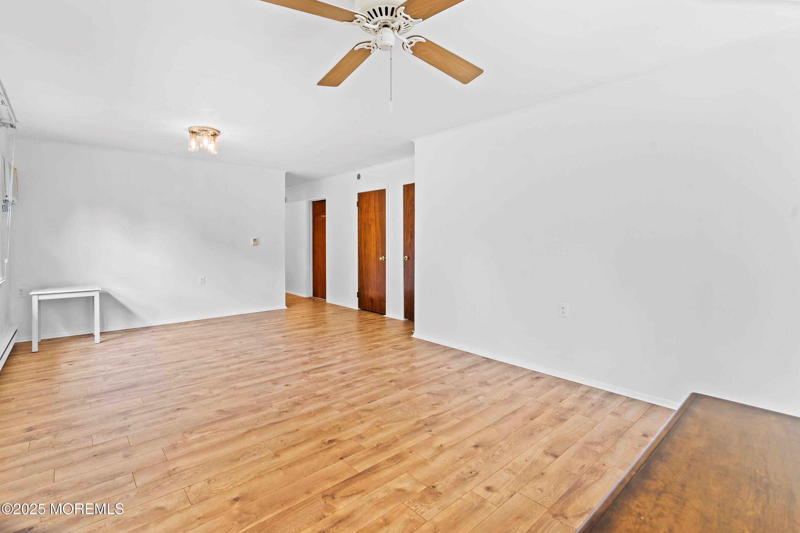 10 Magnolia Road, Unit 19 Manahawkin, NJ 08050 - Photo 10 of 30 a view of empty room with wooden floor and fan