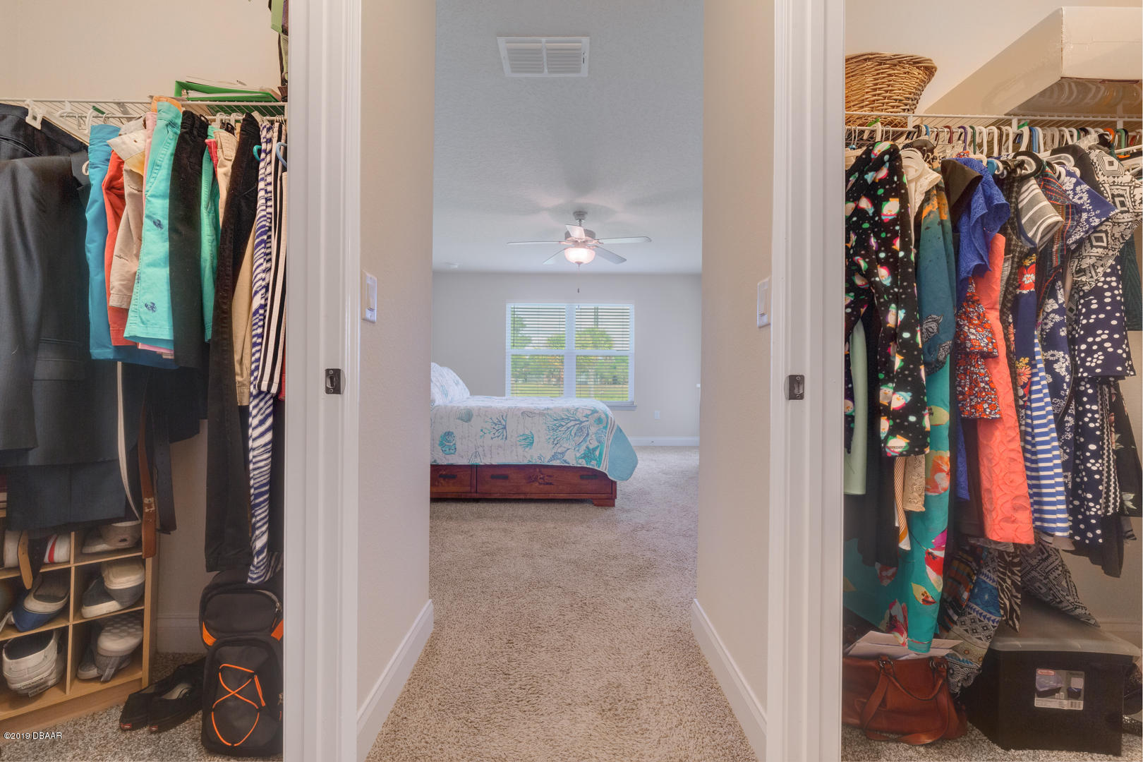 30 Turtle Ridge Drive Flagler Beach, FL 32136 - Photo 14 of 34 a view of walk in closet with clothes and shoes