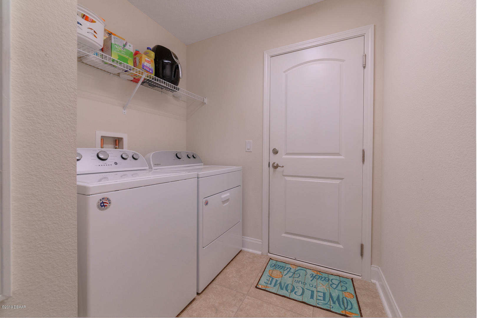 30 Turtle Ridge Drive Flagler Beach, FL 32136 - Photo 17 of 34 a utility room with dryer and washer