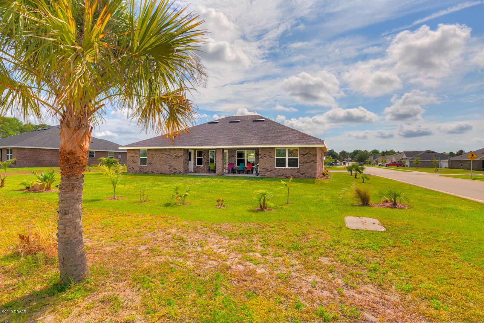 30 Turtle Ridge Drive Flagler Beach, FL 32136 - Photo 30 of 34 a view of a house with swimming pool and a yard