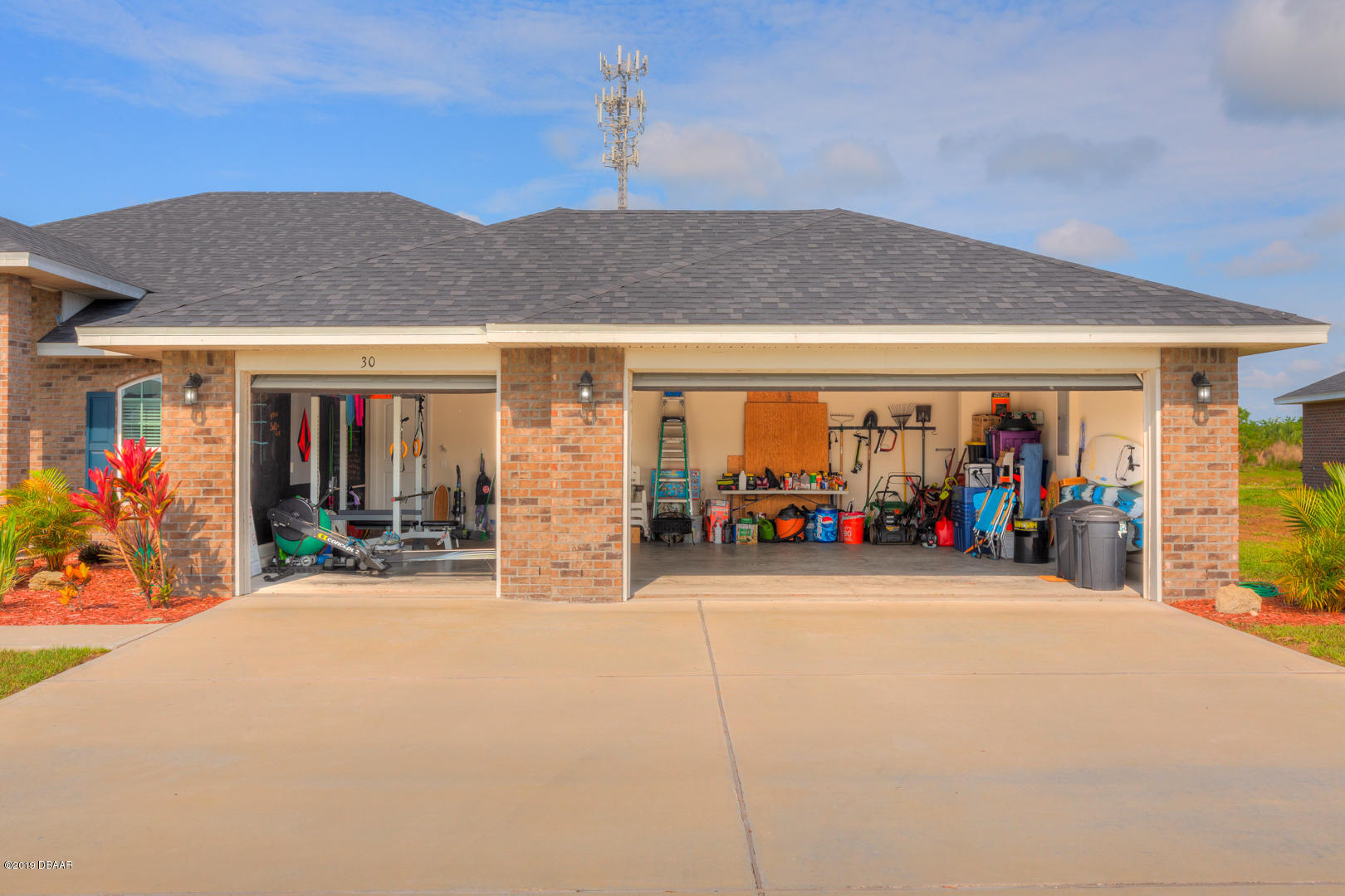 30 Turtle Ridge Drive Flagler Beach, FL 32136 - Photo 32 of 34 a view of a garage with a lot of stuff